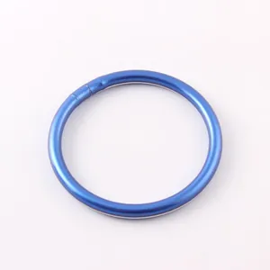 Close-up view of a matte blue silicone ring bracelet showing its smooth circular finish.