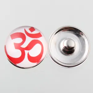 Close-up of 18mm Noosa snap button featuring a red Om symbol glass cabochon detail