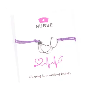 Elegant purple wax cord nurse bracelet with silver stethoscope heart charm on display card