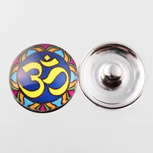 Macro detail of 18mm Noosa snap button featuring Om symbol and colorful Mandala pattern