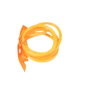 Bright orange neon PVC silicone jelly bangles set tied with a matching satin ribbon
