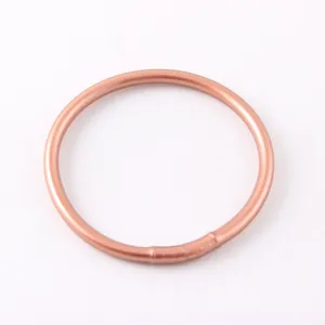 Macro view of a matte rose gold silicone bangle for women elegant summer fashion