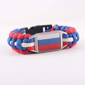 Handmade paracord woven survival bracelet featuring a Russian flag emblem and black buckle