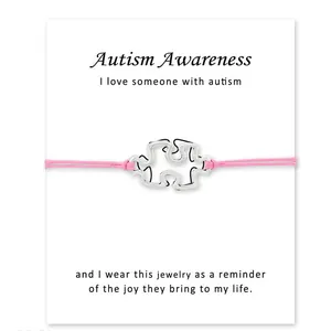 Bracelet puzzle de sensibilisation à l'autisme avec corde cirée rose et carte de message