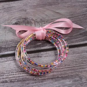 Set of 5 colorful seed bead silicone jelly bangles with elegant pink ribbon bow