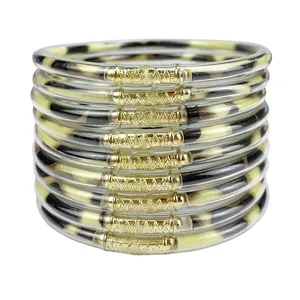 Set of 9 PVC jelly bangles with gold connectors and leopard print pattern