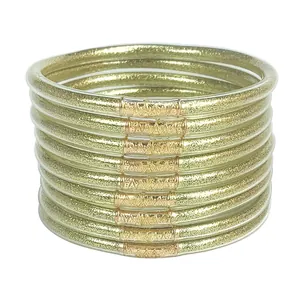 Set of 12 gold glitter jelly bangles made of flexible PVC silicone tubes for women