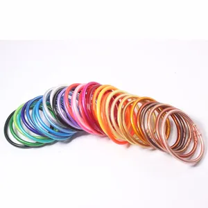 Colorful 5mm sparkling silicone bangles set with metallic finish on white background
