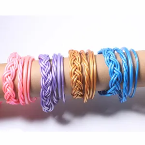 Detailed view of colorful braided PVC jelly bangles in 4-piece fashion jewelry sets
