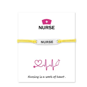 Minimalist yellow cord nurse bracelet presented on 'Nursing is a work of heart' gift card.