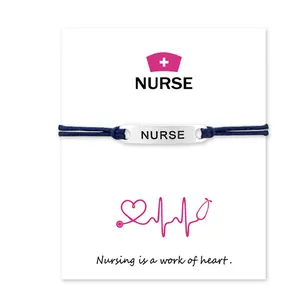 Minimalist blue cord nurse bracelet with engraved metal plate on heart sentiment card