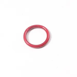 Macro detail view of a smooth red silicone jelly ring showing its flexible texture