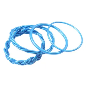 Set of four bright blue braided and smooth flexible silicone jelly bangles for women.