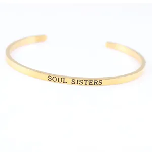 Minimalist gold stainless steel open cuff bracelet featuring Soul Sisters engraving