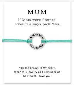 Detail view of Cheer Mom woven bracelet with sentimental Mother's Day message card