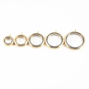 Five gold-toned stainless steel locket pendants with rhinestones in varying sizes.