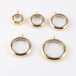 Set of five gold-plated stainless steel round glass locket pendants in various sizes.