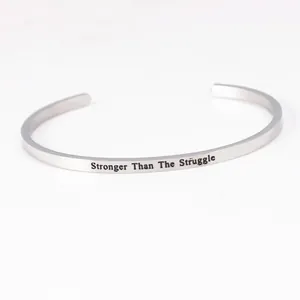 Inspirational stainless steel cuff bracelet with Stronger Than The Struggle engraving