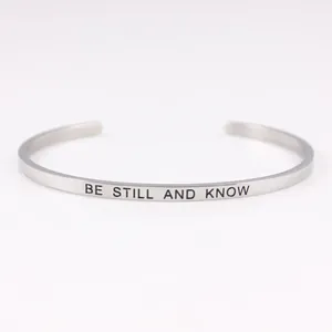 Elegant stainless steel cuff bracelet with BE STILL AND KNOW inspirational engraving.