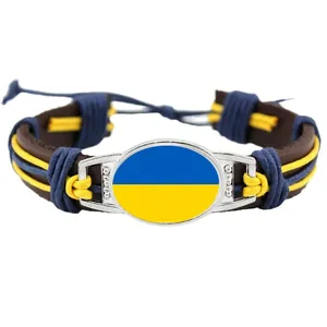 Bracciale in pelle intrecciata a mano con il design della bandiera ucraina blu e gialla