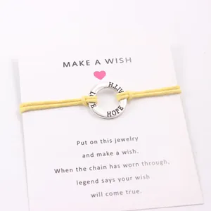 Handmade Faith Hope Love wish card bracelet with a yellow wax cord and alloy ring