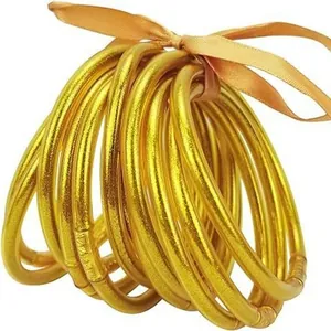 Set of 12 glitter gold jelly bangles with matching ribbon bow decoration