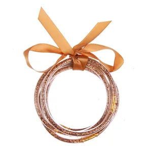Multi-layer gold glitter silicone bracelet set with elegant golden ribbon bow decoration