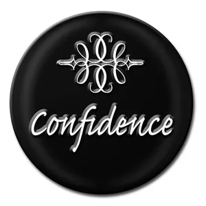 Detailed view of a 12mm Noosa snap button with Confidence script and silver flourish
