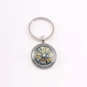 Macro view of a Norse Viking Vegvisir compass time gem glass cabochon pendant keychain