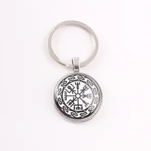 Close-up showing the intricate black and white Viking compass design under glass cabochon