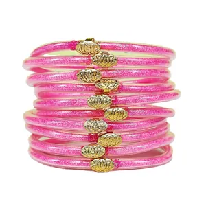 Set di 10 braccialetti jelly glitter rosa con ciondoli a forma di loto dorato lucido