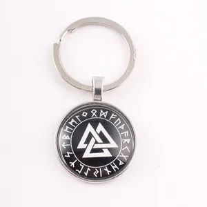 Close-up of Viking Valknut symbol and Norse runes on black circular keychain pendant