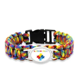 Colorful braided paracord bracelet with Autism Mom puzzle piece heart charm buckle