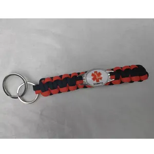 Macro view of red and black diabetic medical alert paracord keychain with star of life
