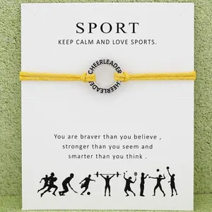 Pulsera de animadora amarilla con tarjeta de mensaje deportivo inspirador