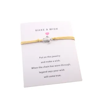 Bracelet de vœux en cordon jaune avec pendentif tortue et carte de vœux incluse.