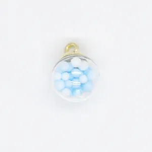 Close-up view of 16mm transparent round charm with blue and white foam ball filling detail