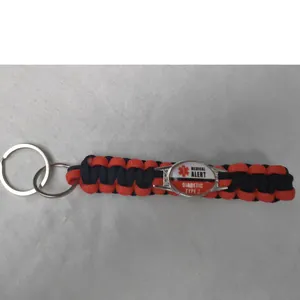 Close-up of Diabetic Type 2 medical alert paracord keychain in red and black