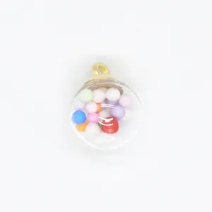 Close-up detail of a 16mm transparent glass orb pendant filled with multicolored mini foam balls