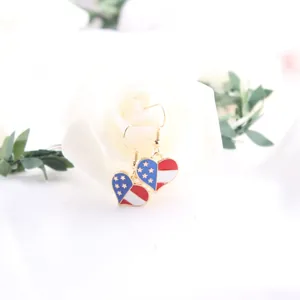 Heart-shaped American flag drop earrings with patriotic stars and stripes design for women.