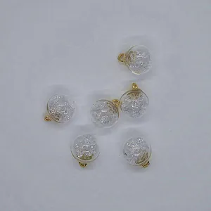 Detail view of 16mm transparent round glass ball pendants with crushed crystal fillers