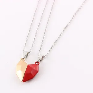 Detailed macro view showing the magnetic connection of faceted heart pendants for couples