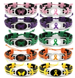 Pulseras de concienciación de cuero trenzado a mano con lazos de colores y motivos de mariposa.
