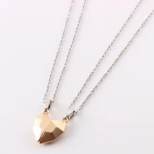 Close-up detail of magnetic geometric heart-shaped pendants for couple necklace sets