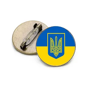 Detailed view of Ukrainian coat of arms brooch with vintage bronze metal safety pin