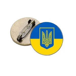 Vintage Ukraine flag trident brooch featuring a bronze metal pin base on a clean white background