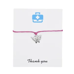 Dentist gift bracelet with angel tooth pendant on pink cord and thank you card