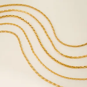 Detailed close-up showing five different styles of vintage gold plated jewelry chains
