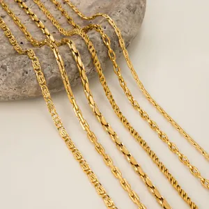 Close-up of vintage gold chain necklaces with various link designs and textures