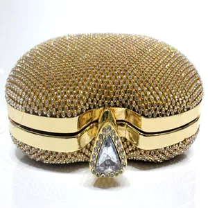 Exquisite gold rhinestone evening clutch bag with a luxury crystal triangular clasp